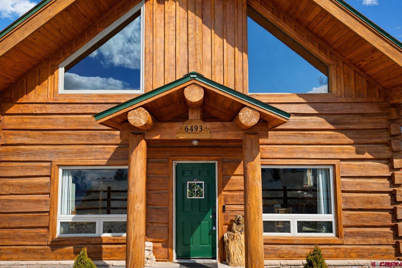 6493 Townsend Road Delta, CO 81416 - Photo 16 of 38 a front view of a house with a front door