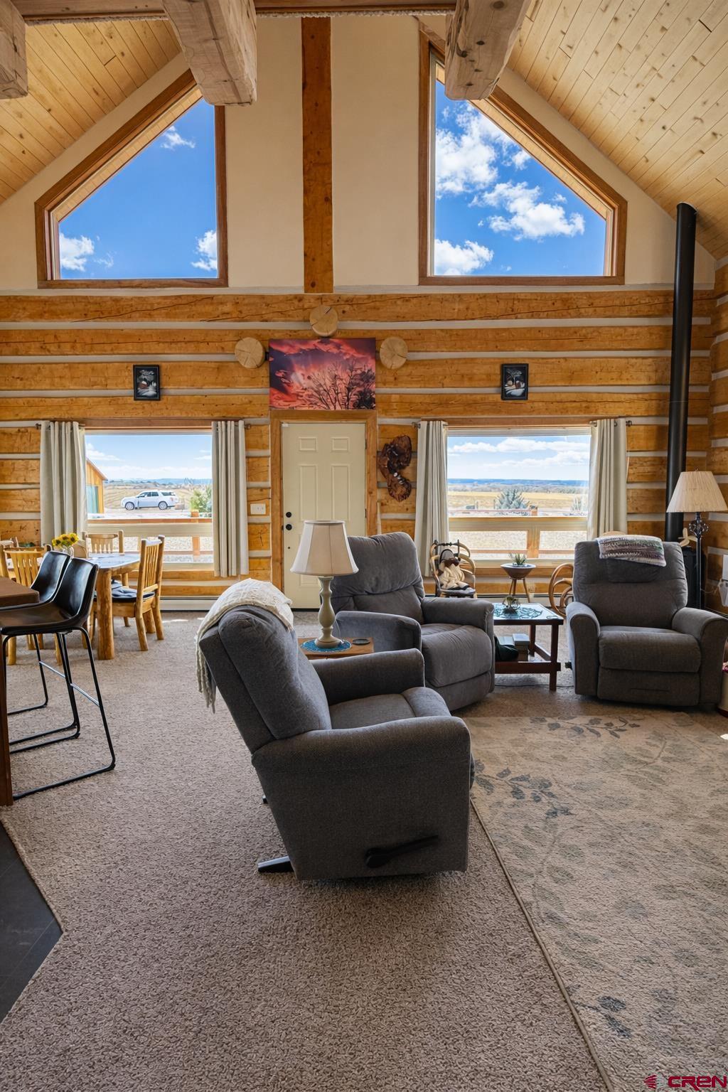 6493 Townsend Road Delta, CO 81416 - Photo 17 of 38 a living room with furniture and a large window