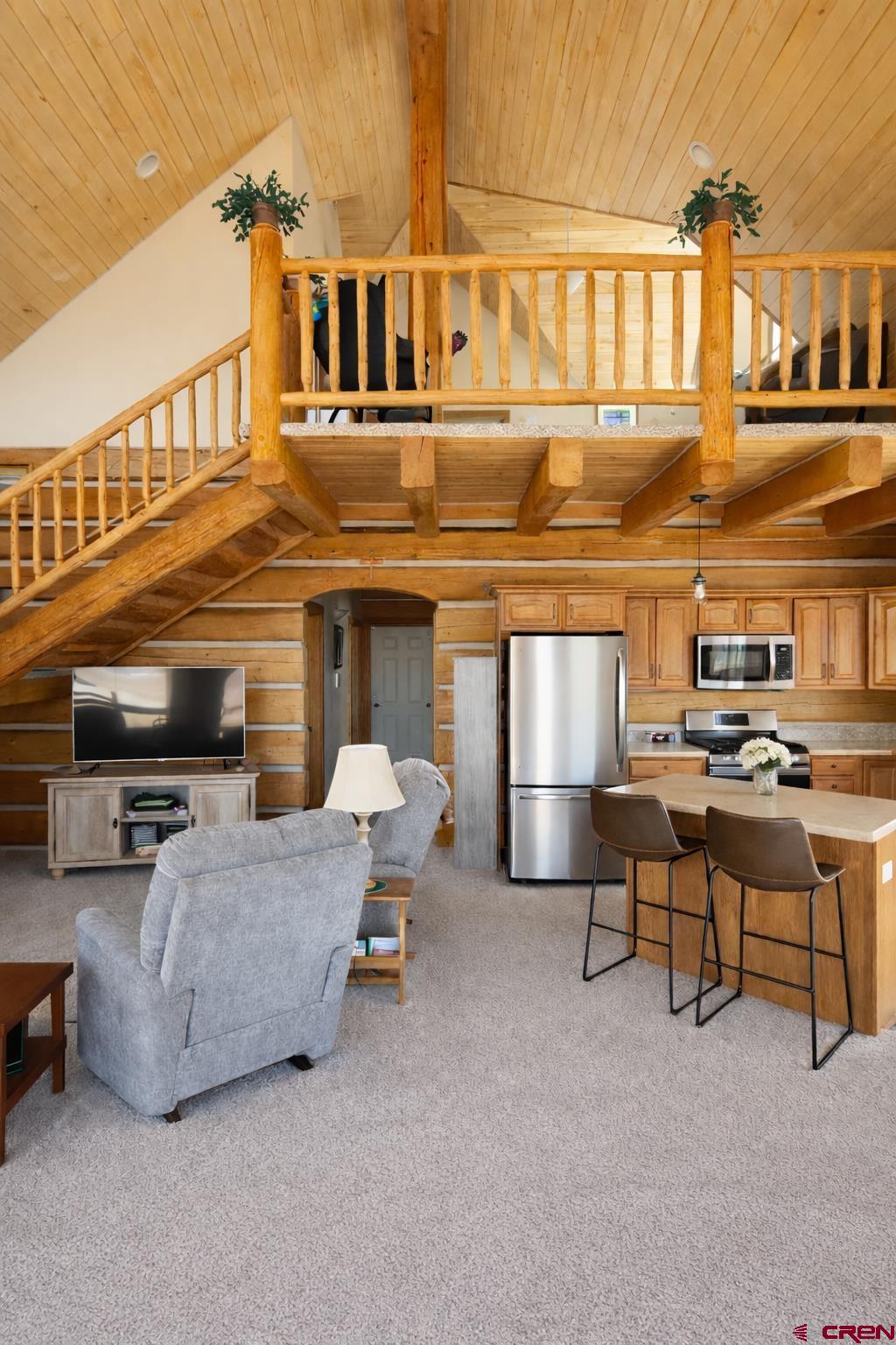6493 Townsend Road Delta, CO 81416 - Photo 18 of 38 a living room with furniture and a flat screen tv