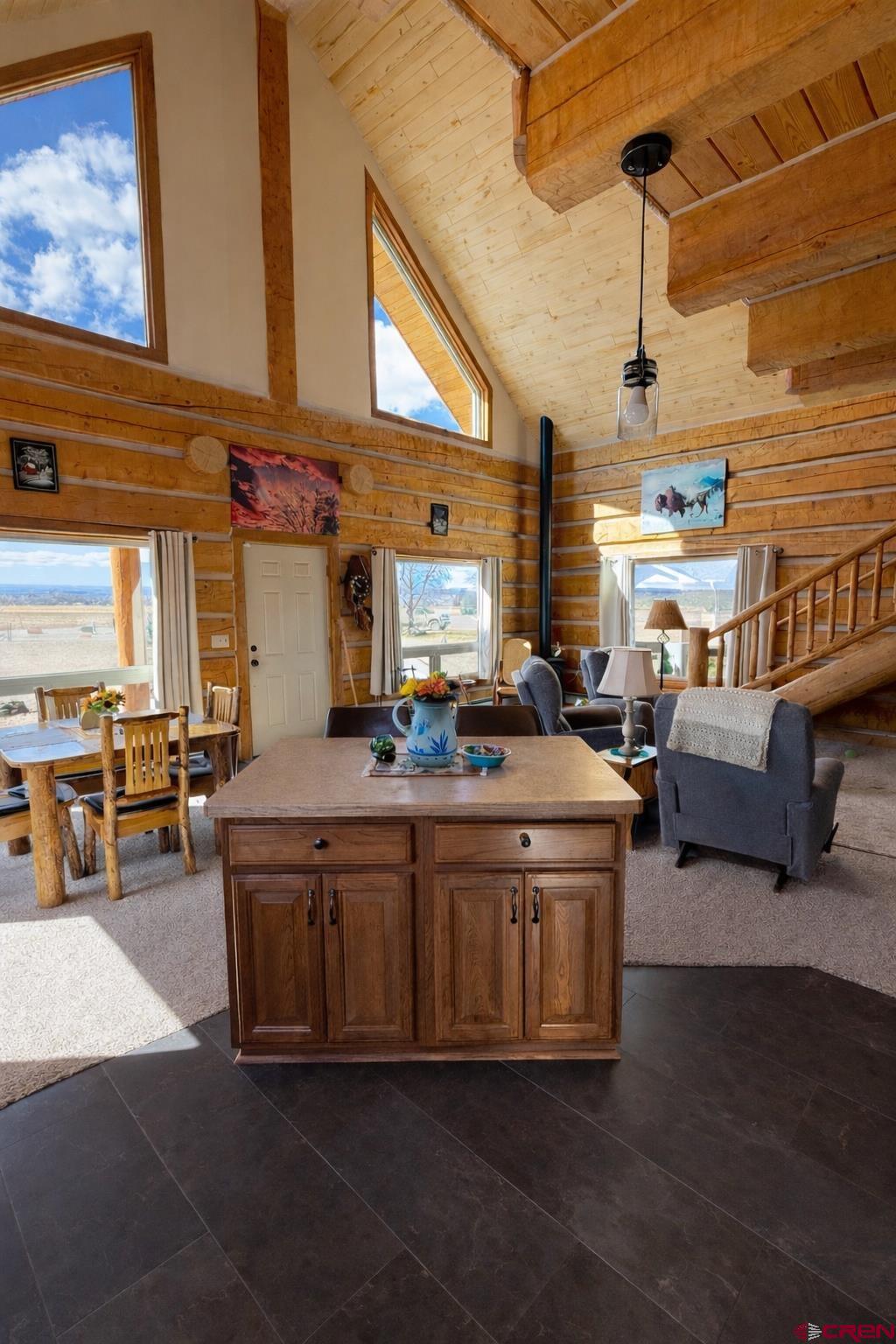 6493 Townsend Road Delta, CO 81416 - Photo 22 of 38 a kitchen with stainless steel appliances kitchen island granite countertop a stove and a refrigerator