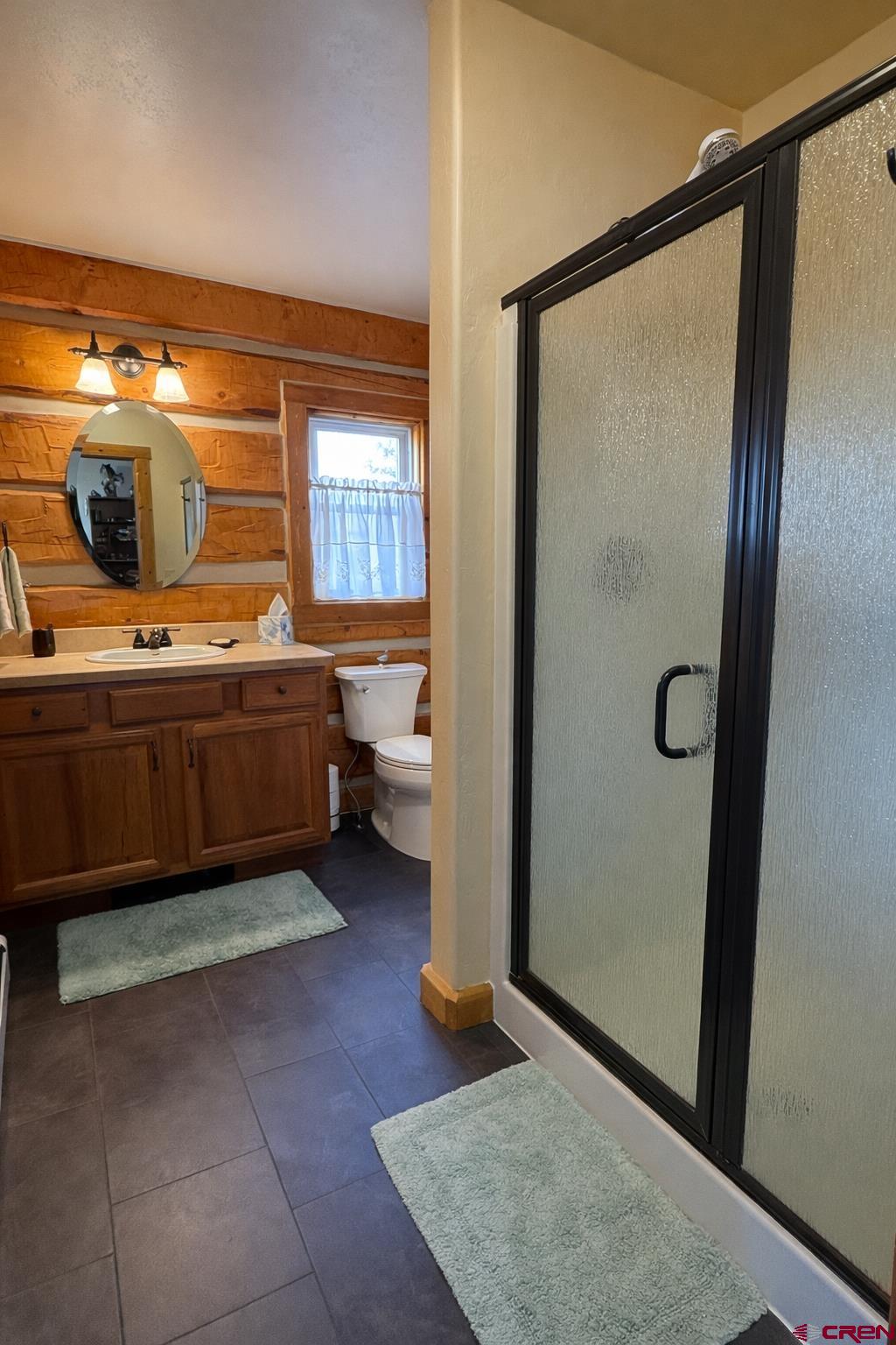 6493 Townsend Road Delta, CO 81416 - Photo 24 of 38 a bedroom with a bed and glass door