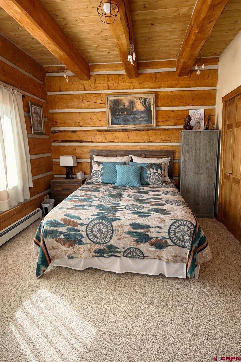 6493 Townsend Road Delta, CO 81416 - Photo 26 of 38 a bedroom with a bed next to a window