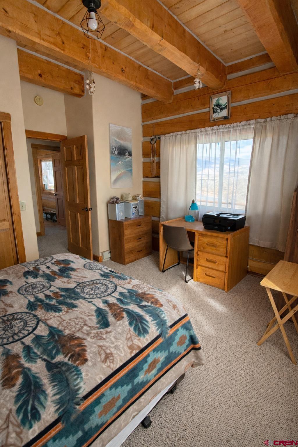 6493 Townsend Road Delta, CO 81416 - Photo 27 of 38 a living room with furniture rug and wooden floor