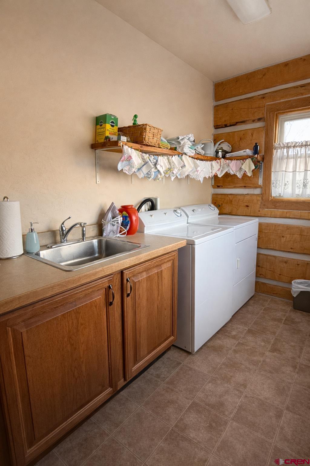 6493 Townsend Road Delta, CO 81416 - Photo 28 of 38 a utility room with sink dryer and washer