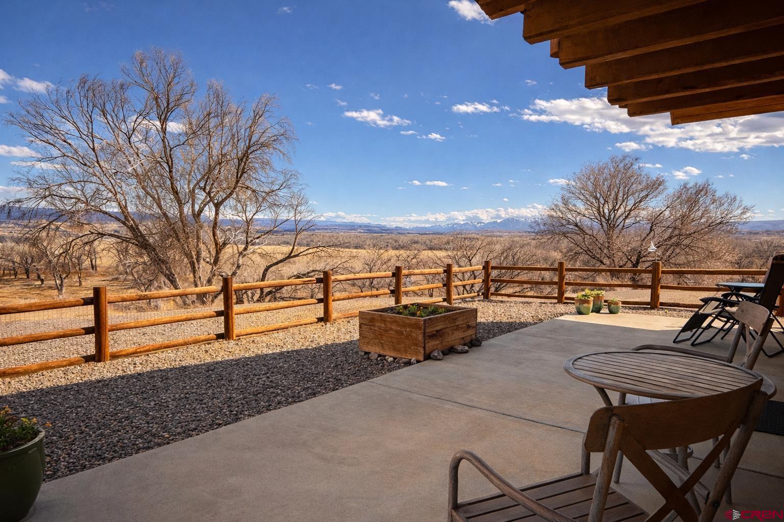 6493 Townsend Road Delta, CO 81416 - Photo 30 of 38 a view of a terrace with chairs and wooden fence