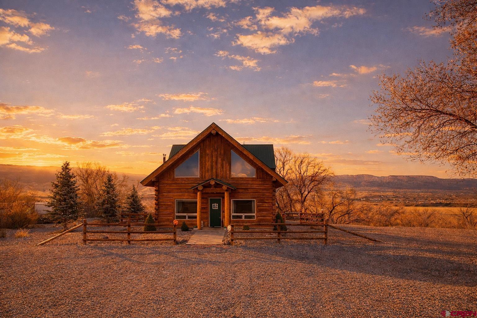 6493 Townsend Road Delta, CO 81416 - Photo 35 of 38 a view of a house with a yard