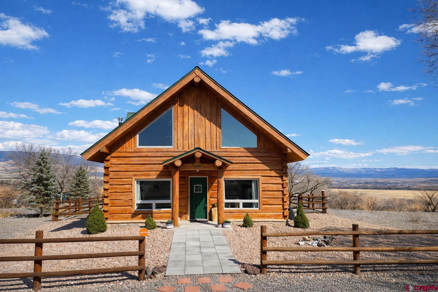 6493 Townsend Road Delta, CO 81416 - Photo 37 of 38 a view of a house with a yard
