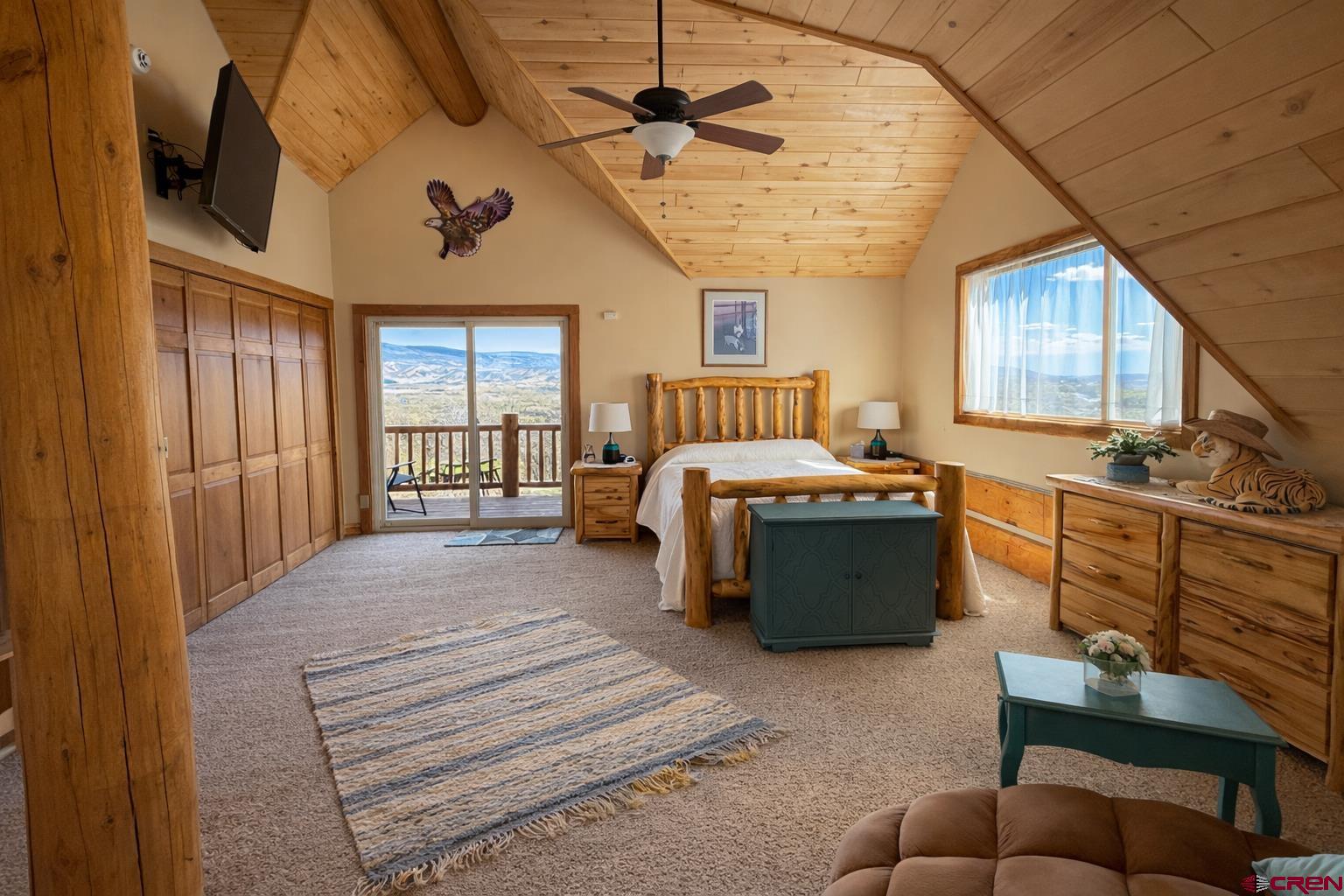 6493 Townsend Road Delta, CO 81416 - Photo 4 of 38 a living room with furniture a ceiling fan and a window