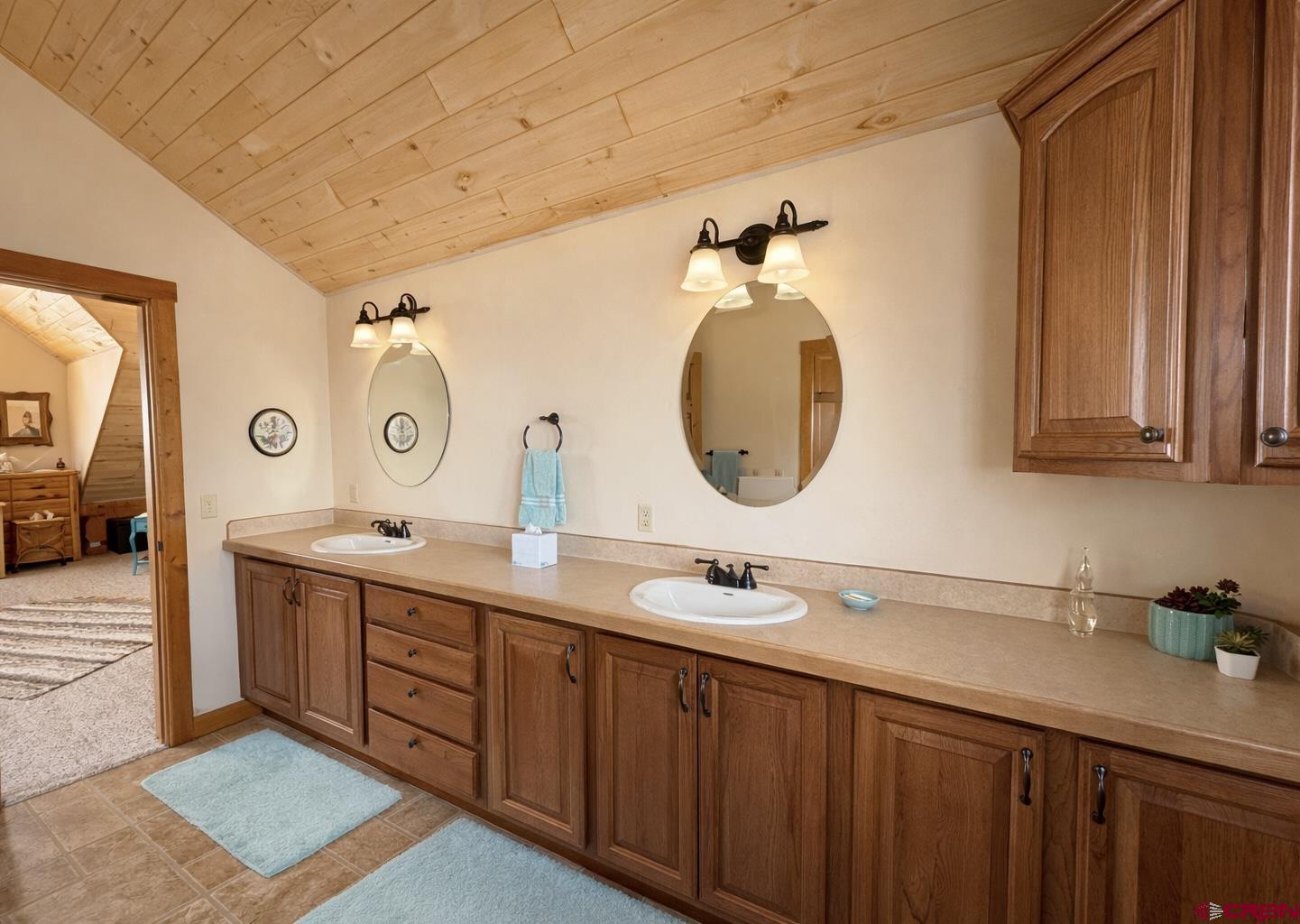 6493 Townsend Road Delta, CO 81416 - Photo 7 of 38 a bathroom with a double vanity sink and a mirror