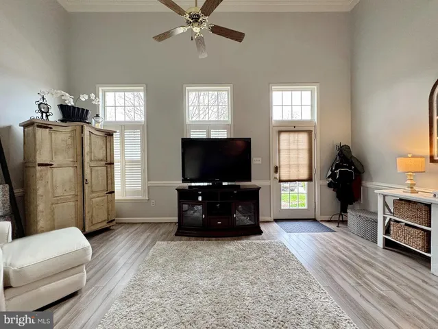 a kitchen with kitchen island a sink stainless steel appliances and cabinets