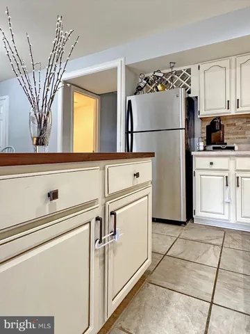 a stove top oven sitting inside of a kitchen