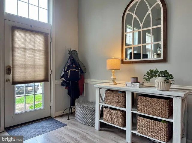 a kitchen with stainless steel appliances granite countertop a refrigerator sink stove microwave and cabinets