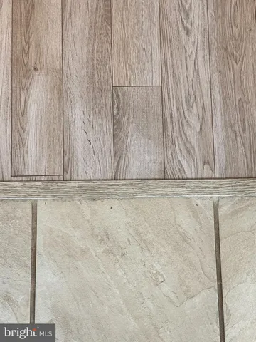 a bedroom with a bed and a night stand