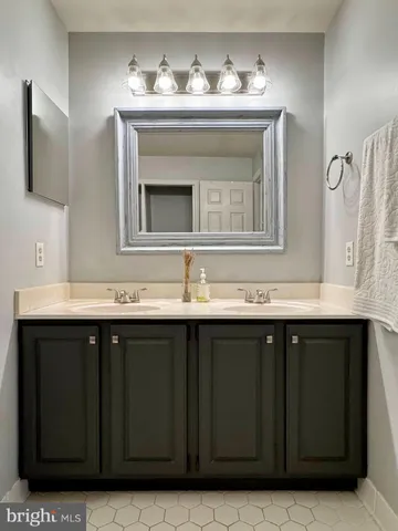 a bathroom with a sink a toilet and shower curtain
