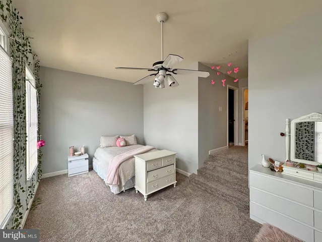 a bedroom with a bed and furniture