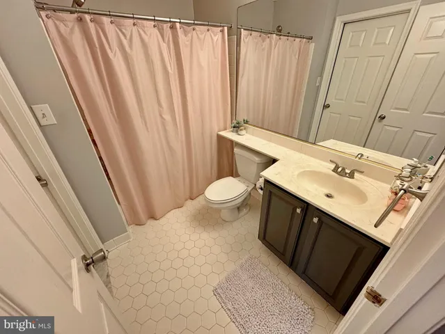 a view of a wooden fence next to a yard