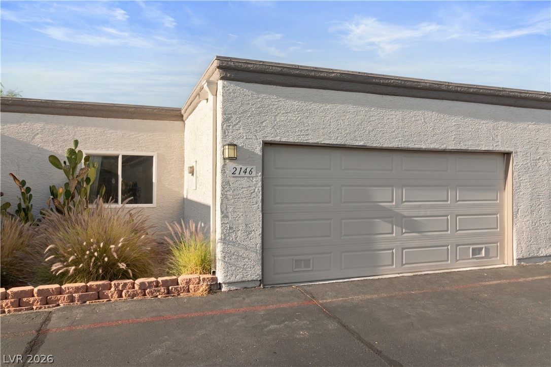 2146 High Dunes Lane Laughlin, NV 89029 - Photo 59 of 64 Garage featuring aphalt driveway