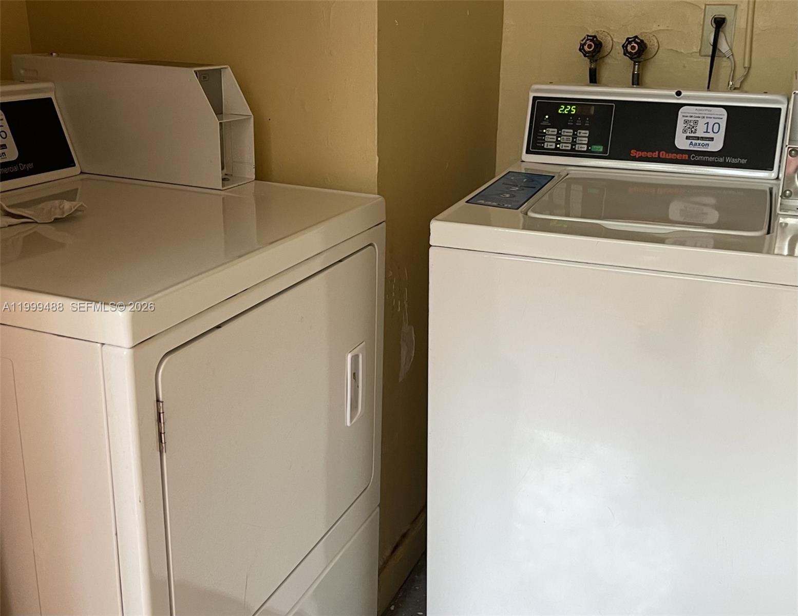 1250 Lincoln Road, Unit 306 Miami Beach, FL 33139 - Photo 12 of 12 a utility room with dryer and washer