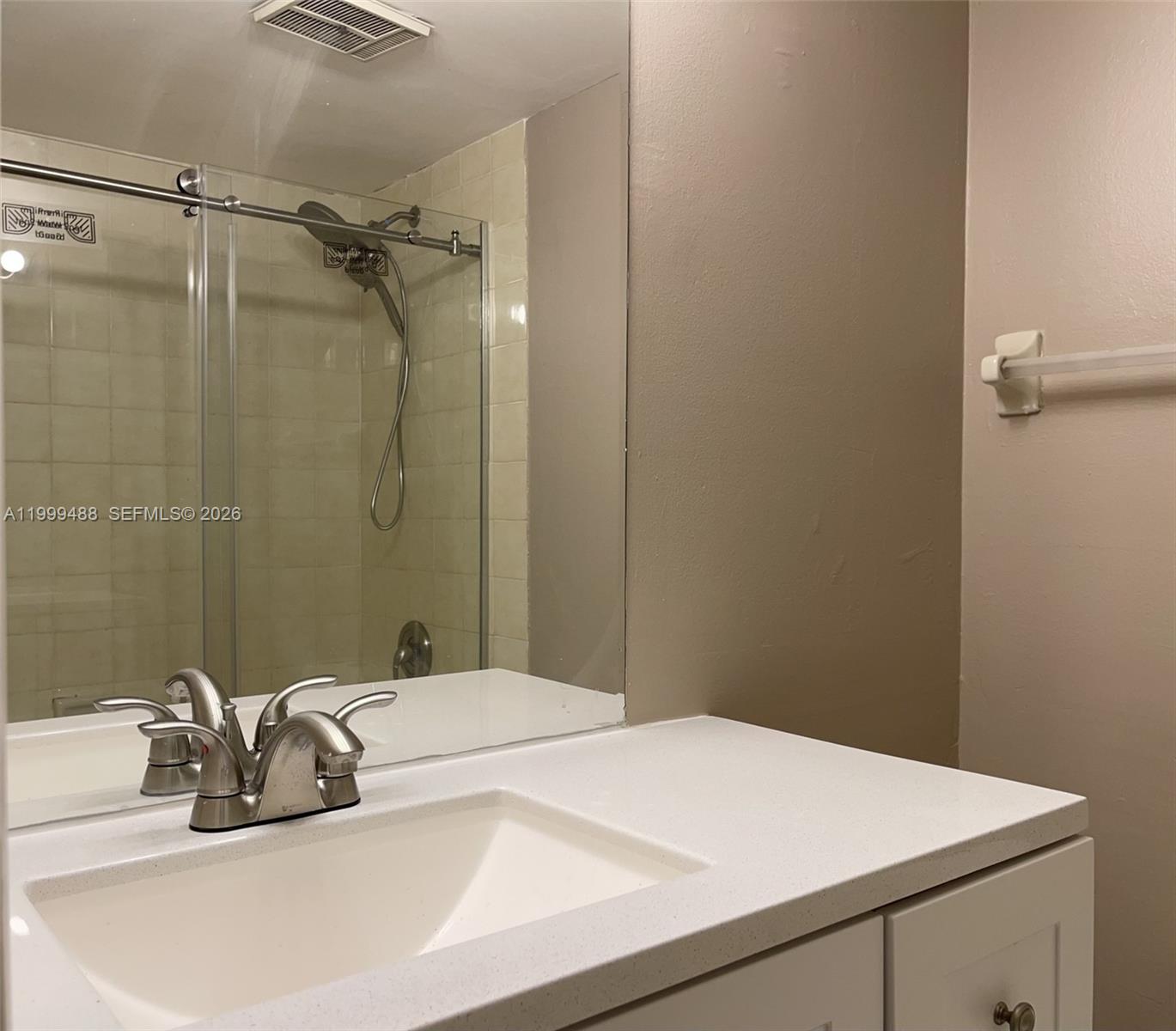 1250 Lincoln Road, Unit 306 Miami Beach, FL 33139 - Photo 5 of 12 a bathroom with a sink and a mirror