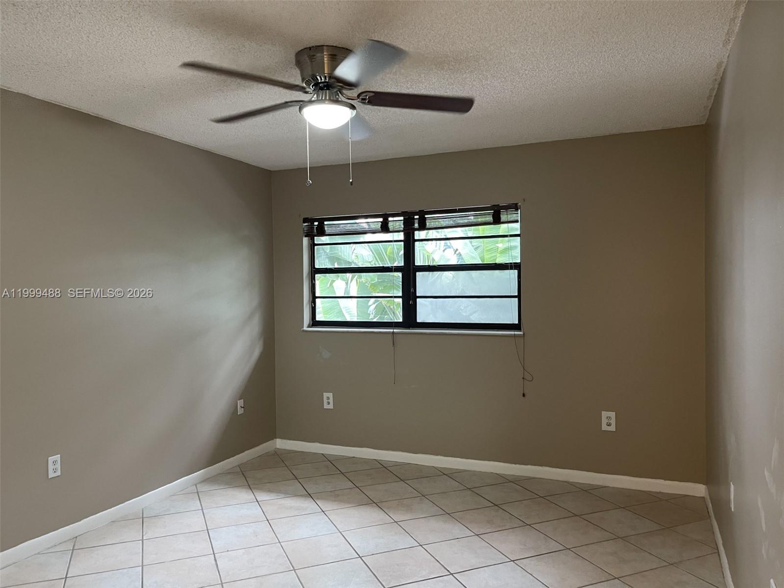 1250 Lincoln Road, Unit 306 Miami Beach, FL 33139 - Photo 7 of 12 a view of an empty room with a window