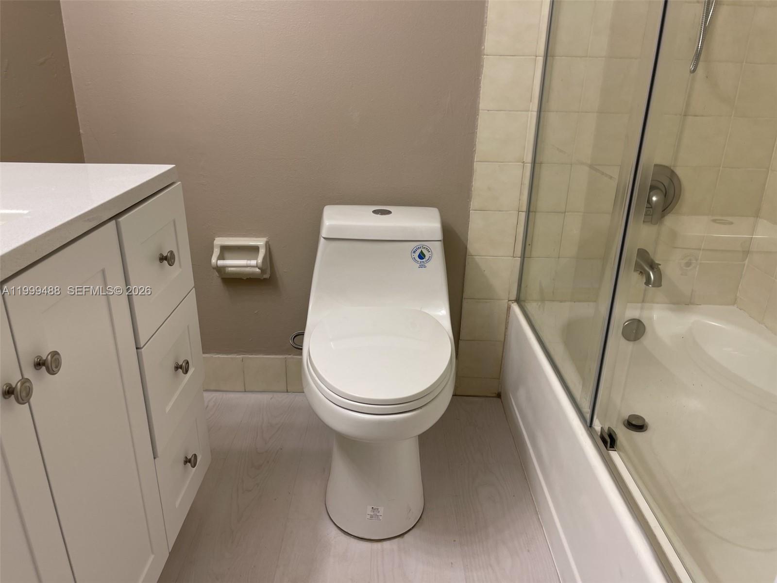 1250 Lincoln Road, Unit 306 Miami Beach, FL 33139 - Photo 9 of 12 a view of a bathroom with a sink and toilet