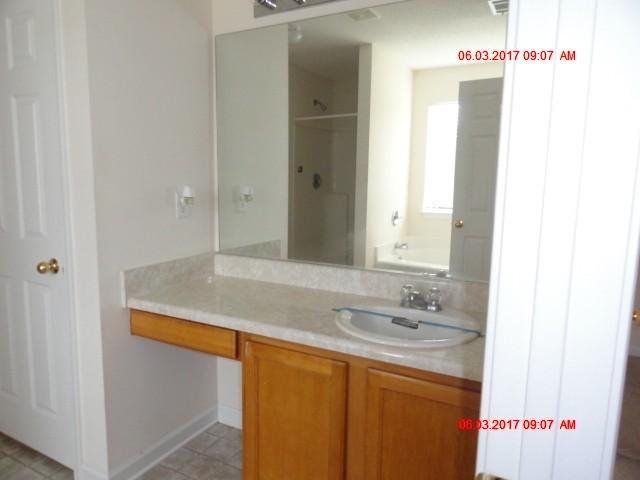 339 Dahlquist Drive Crestview, FL 32539 - Photo 13 of 15 a bathroom with a sink and a mirror