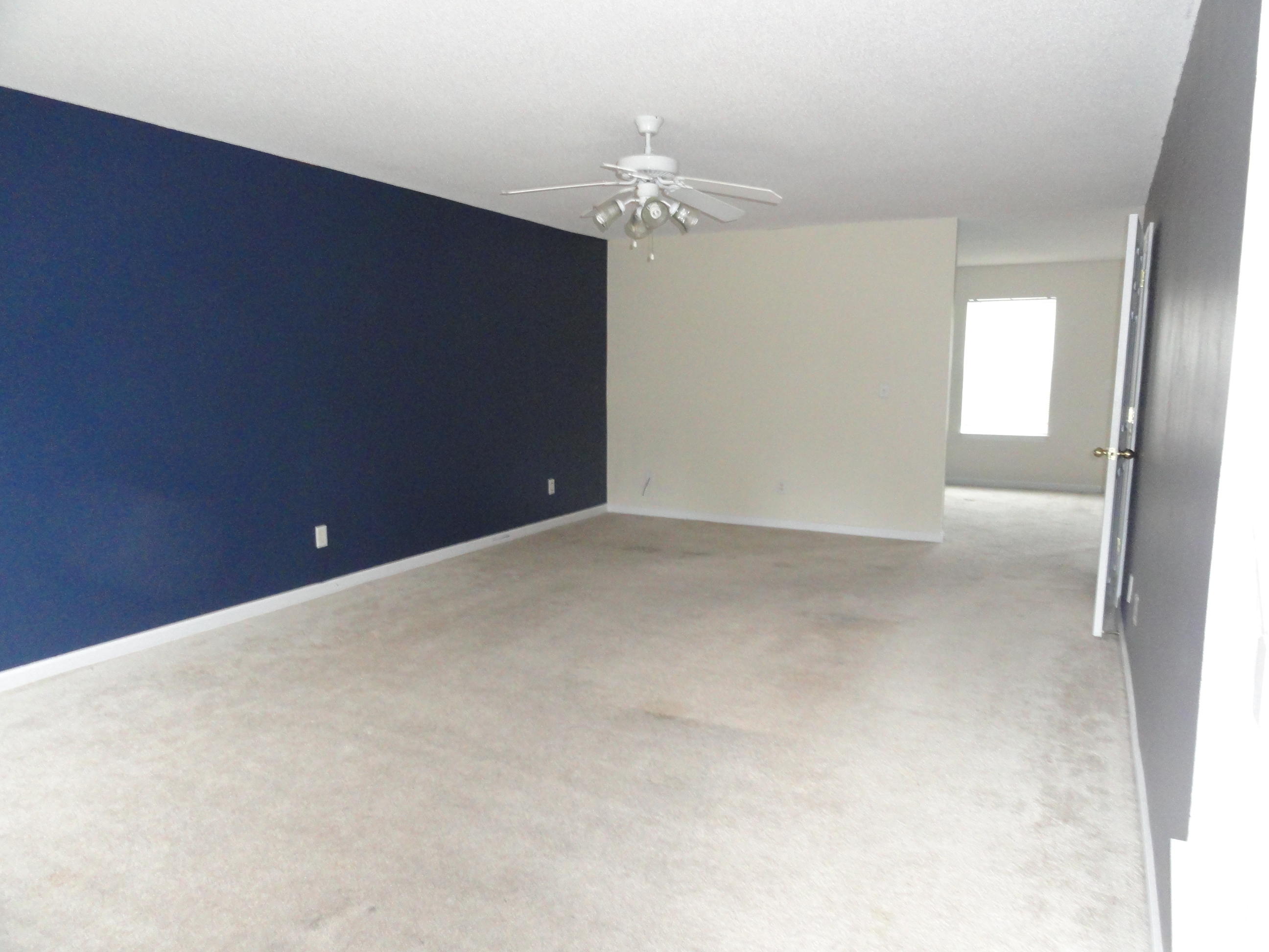 339 Dahlquist Drive Crestview, FL 32539 - Photo 2 of 15 a view of an empty room with a chandelier