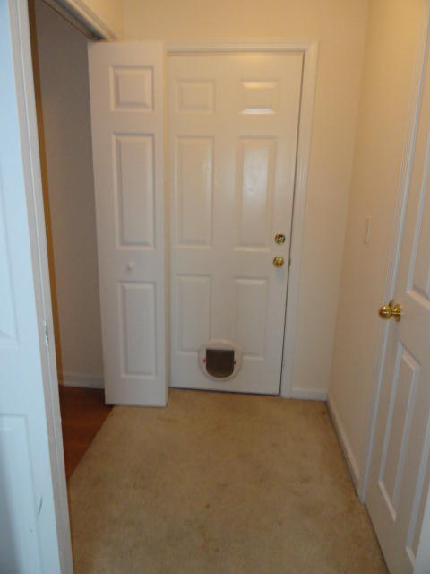 339 Dahlquist Drive Crestview, FL 32539 - Photo 8 of 15 an empty room with wooden door