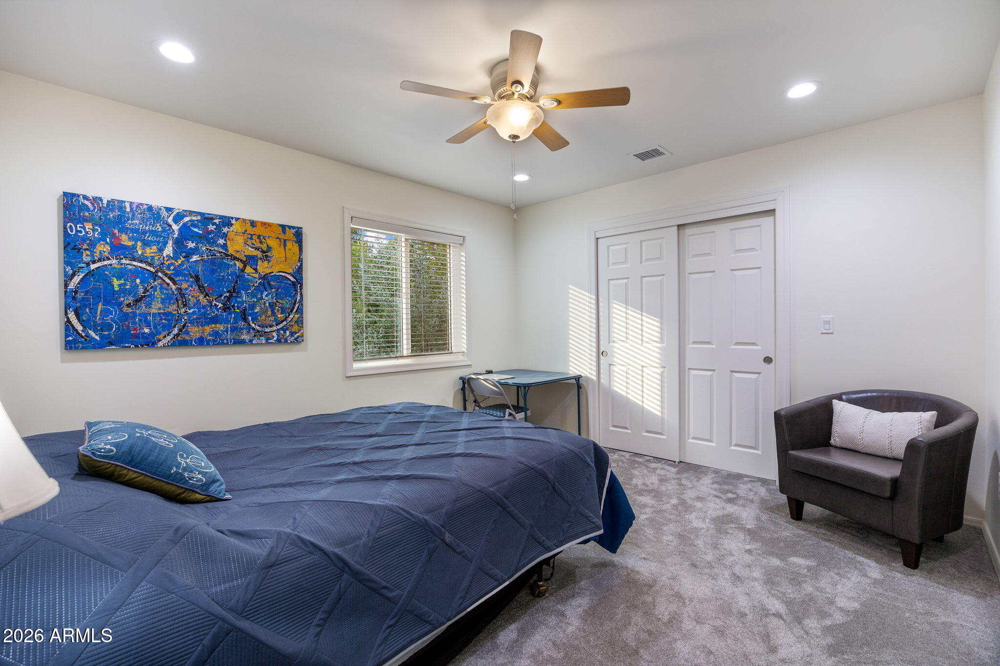 5145 Drifting Snow Loop Pinetop, AZ 85935 - Photo 15 of 37 a spacious bedroom with a bed and a couch