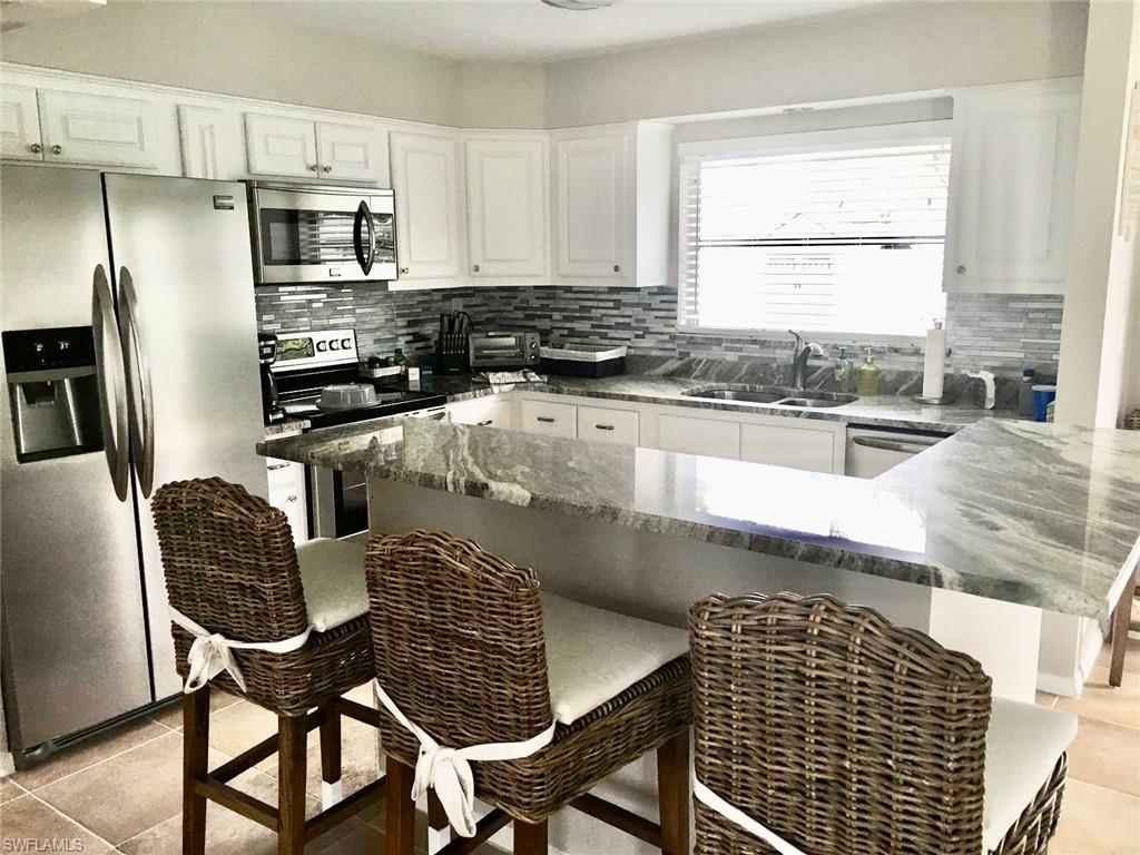 1023 Illinois Drive Naples, FL 34103 - Photo 9 of 14 Kitchen Breakfast BarPICTURE TAKEN PRIOR TO TENANT