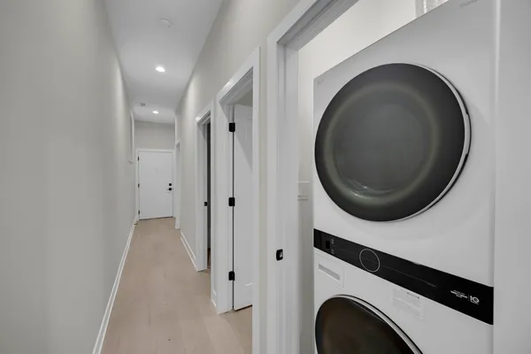 a close view of a utility room with dryer and washer