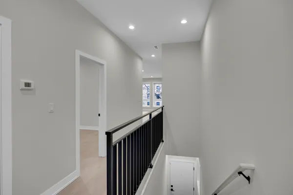 a view of entryway and hall with a window