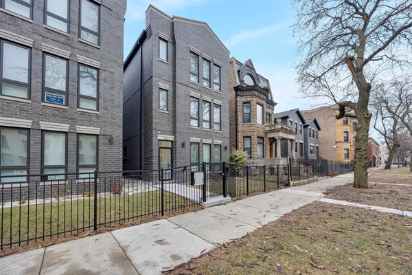 a view of a brick building and a street view