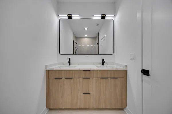 a bathroom with a sink and a mirror