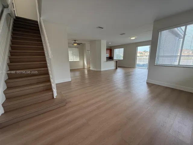 a bathroom with a double vanity sink toilet and a mirror