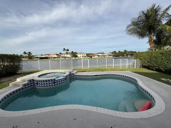 a view of a swimming pool with a terrace