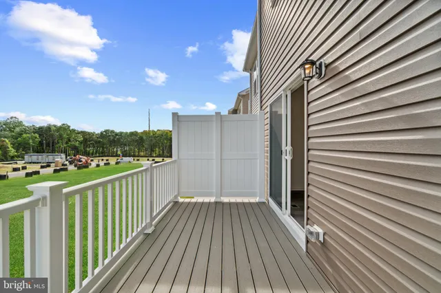 a view of a balcony with wooden floor