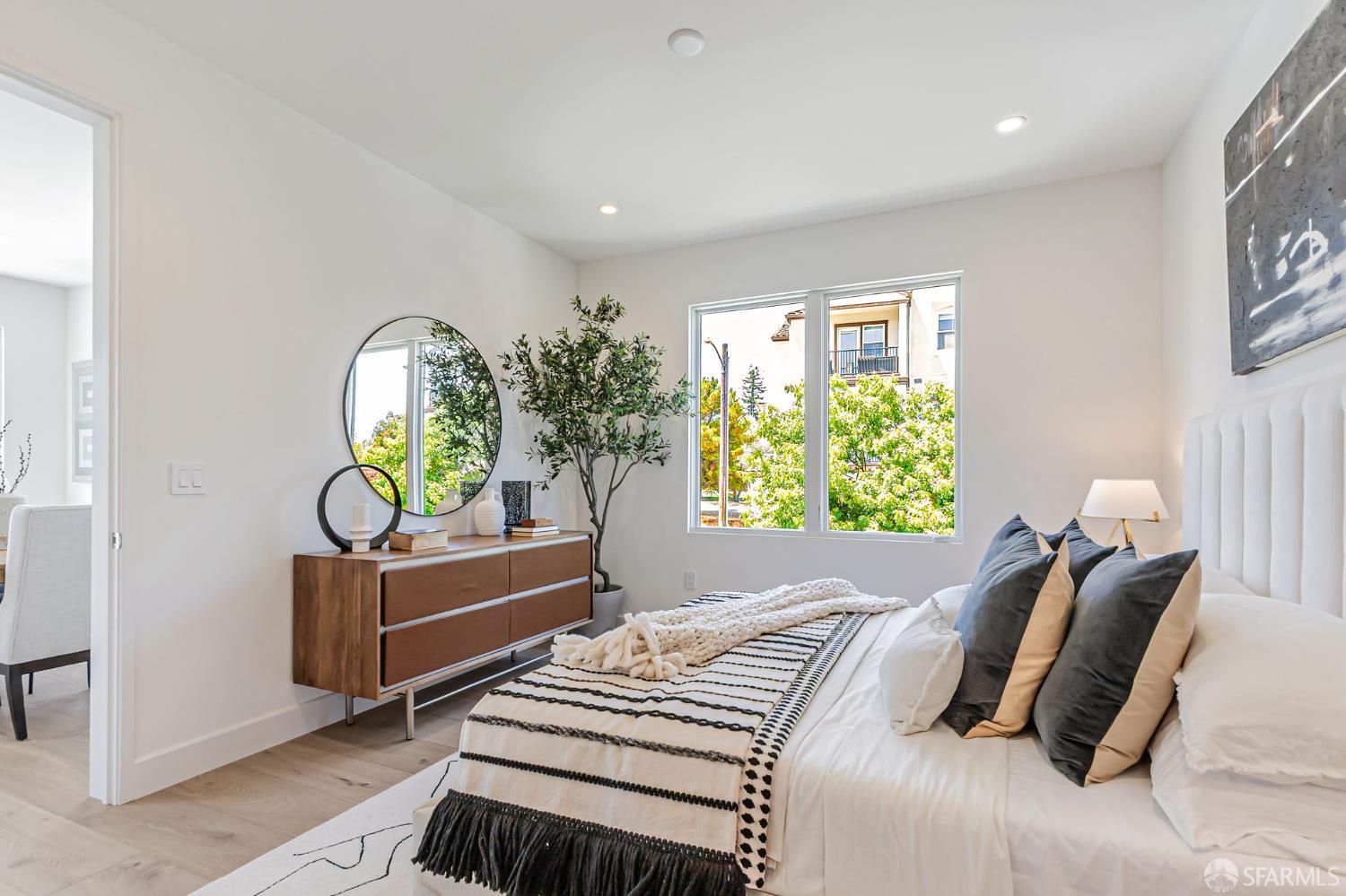 425 1st Street, Unit 21 Los Altos, CA 94022 - Photo 15 of 41 a bedroom with furniture and a window