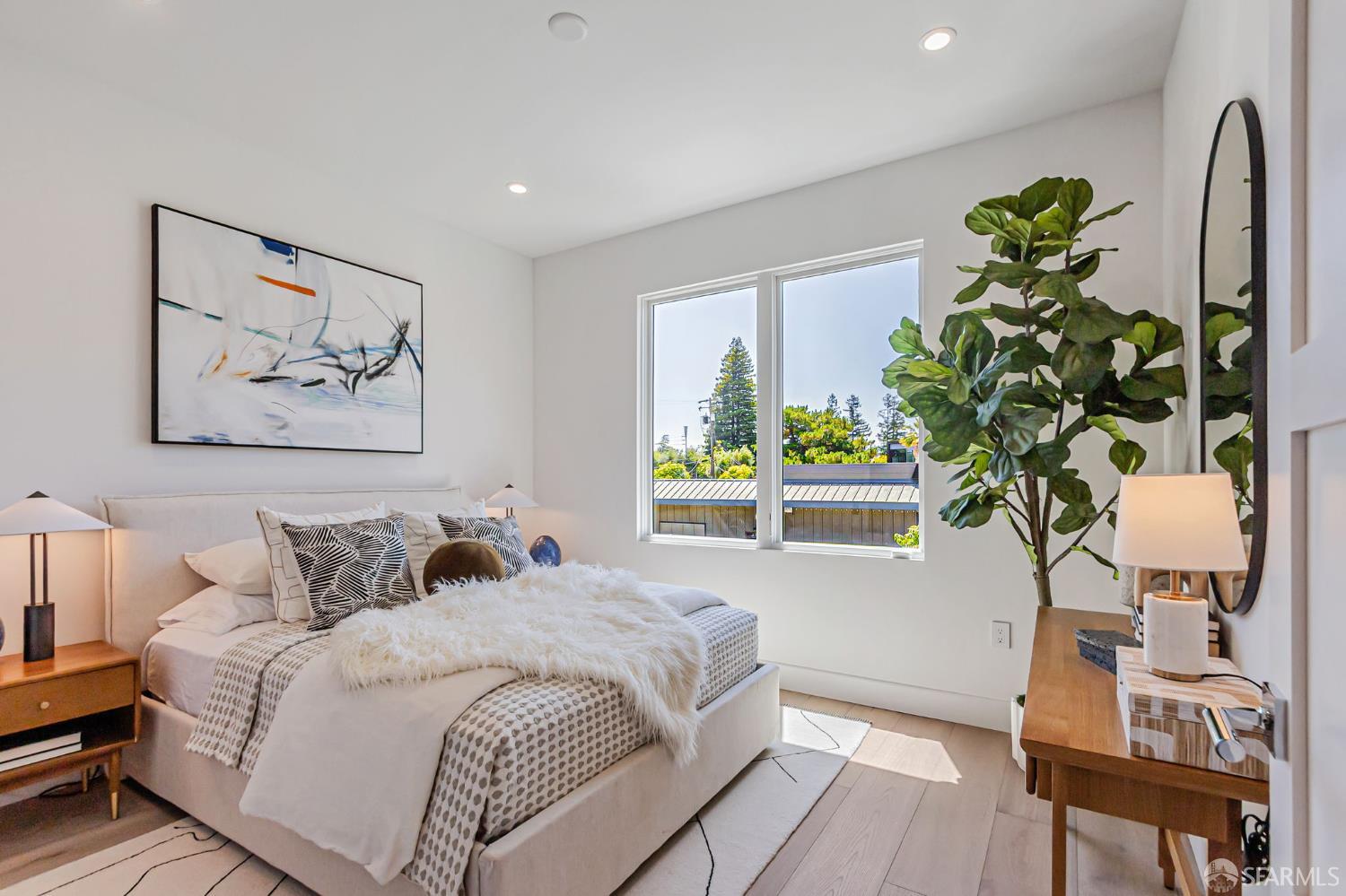 425 1st Street, Unit 21 Los Altos, CA 94022 - Photo 18 of 41 a bedroom with a bed and a potted plant