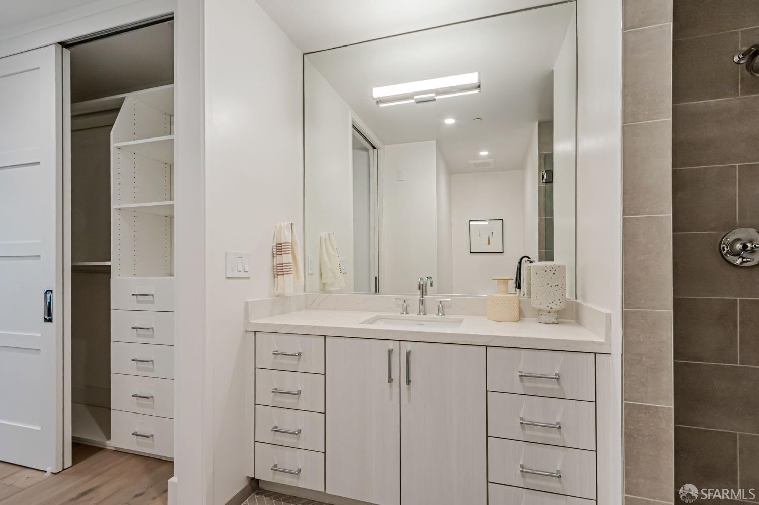 425 1st Street, Unit 21 Los Altos, CA 94022 - Photo 24 of 41 a bathroom with double sink and a mirror