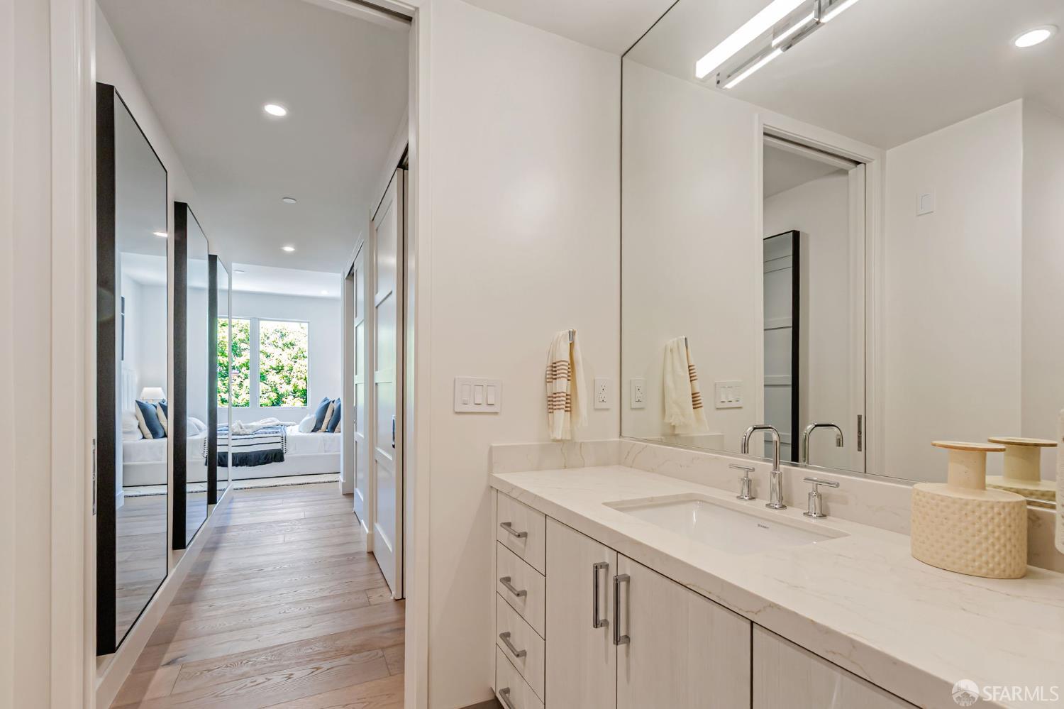 425 1st Street, Unit 21 Los Altos, CA 94022 - Photo 25 of 41 a bathroom with a sink and a mirror