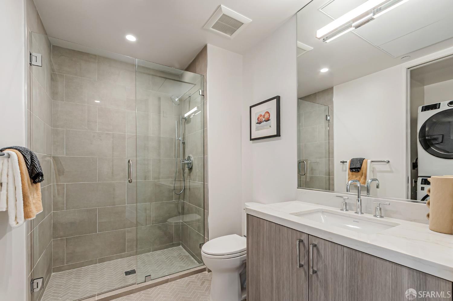 425 1st Street, Unit 21 Los Altos, CA 94022 - Photo 26 of 41 a bathroom with a sink toilet and shower