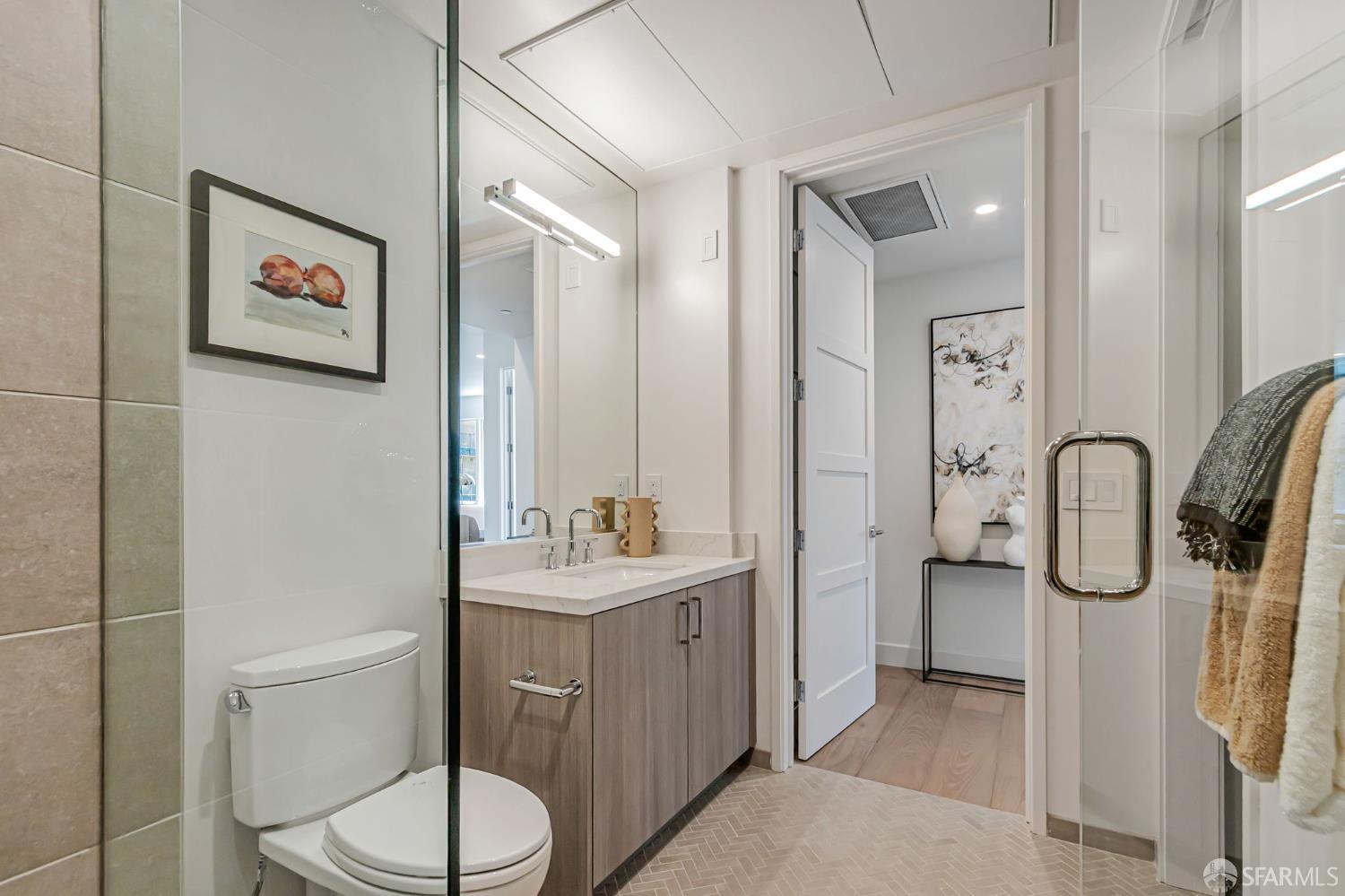 425 1st Street, Unit 21 Los Altos, CA 94022 - Photo 27 of 41 a bathroom with a toilet sink and shower