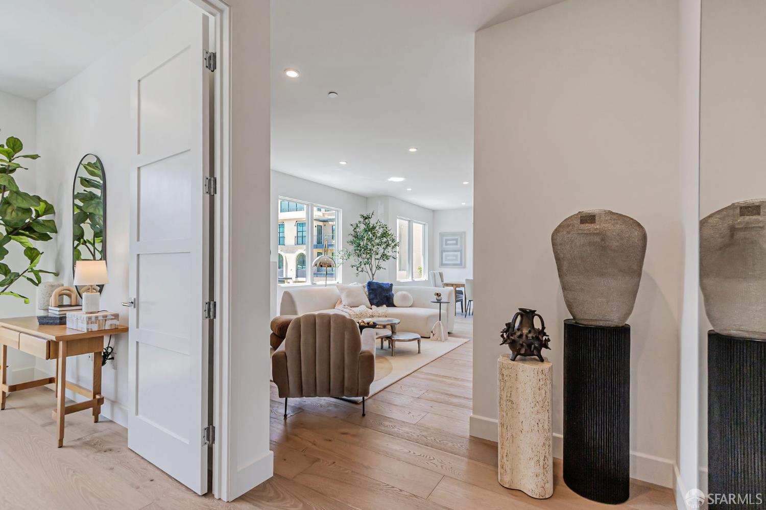 425 1st Street, Unit 21 Los Altos, CA 94022 - Photo 29 of 41 a living room with furniture a wooden floor and a chandelier