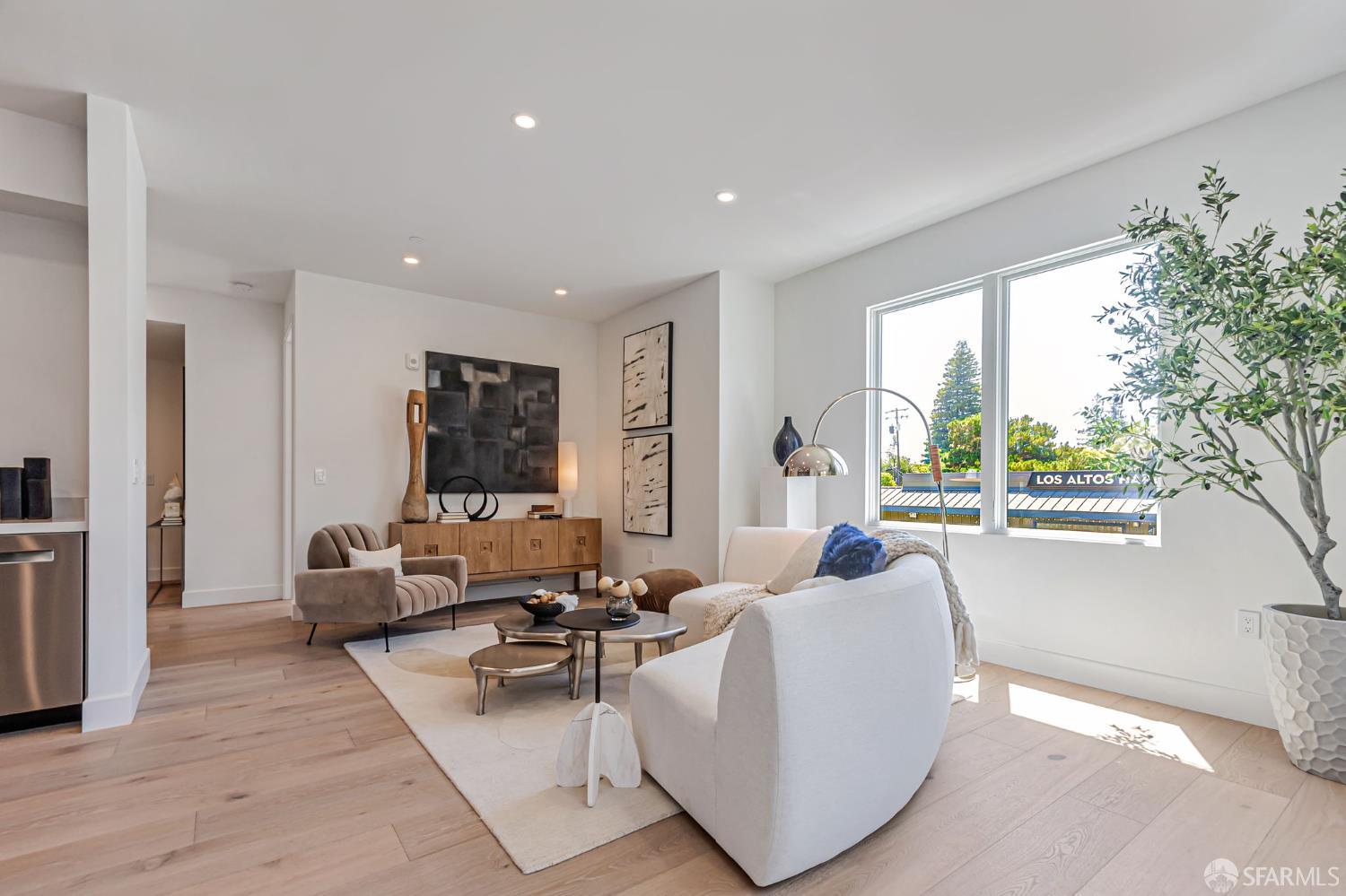 425 1st Street, Unit 21 Los Altos, CA 94022 - Photo 3 of 41 a living room with furniture and a large window
