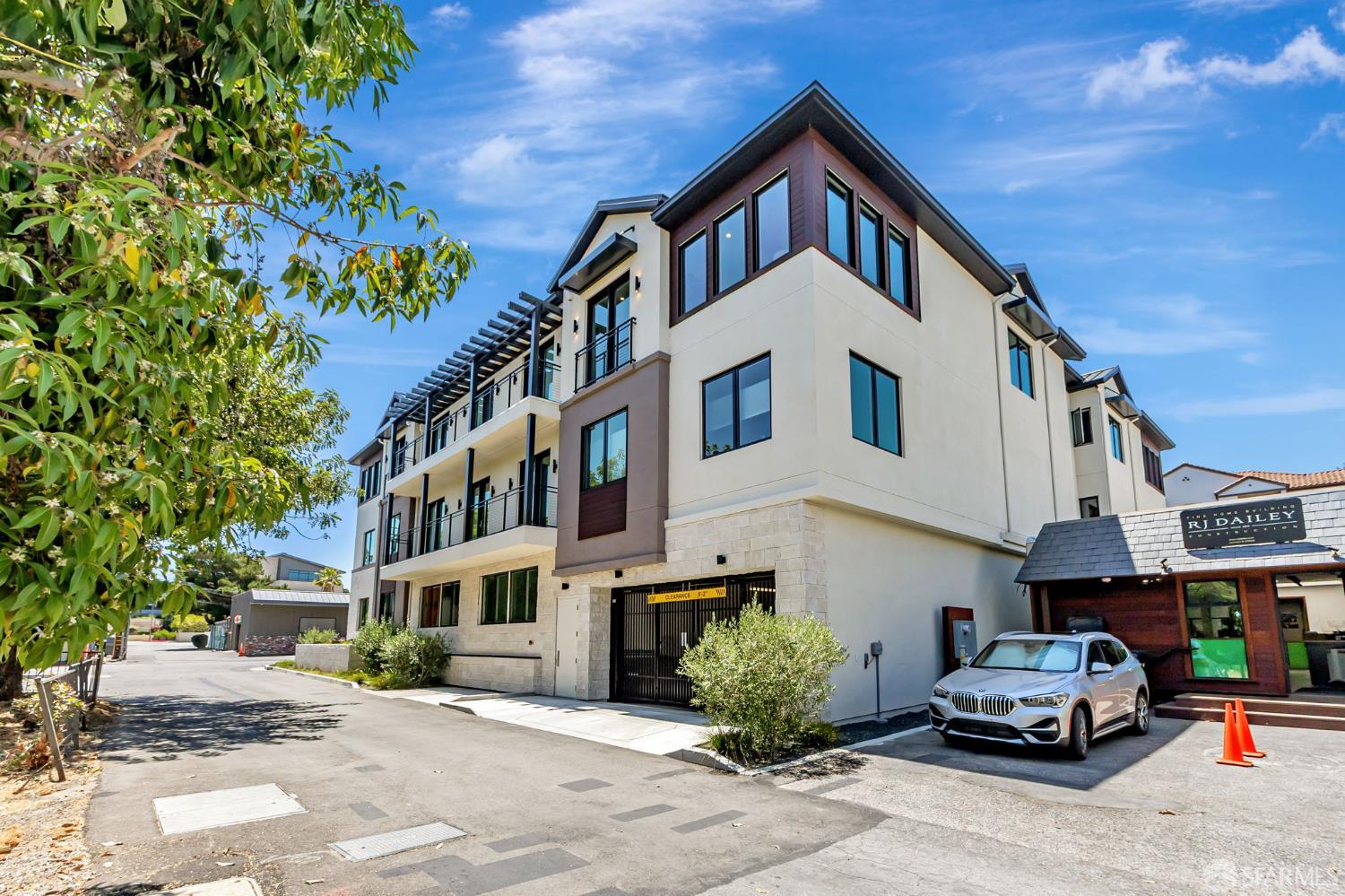 425 1st Street, Unit 21 Los Altos, CA 94022 - Photo 41 of 41 a car parked in front of a white building