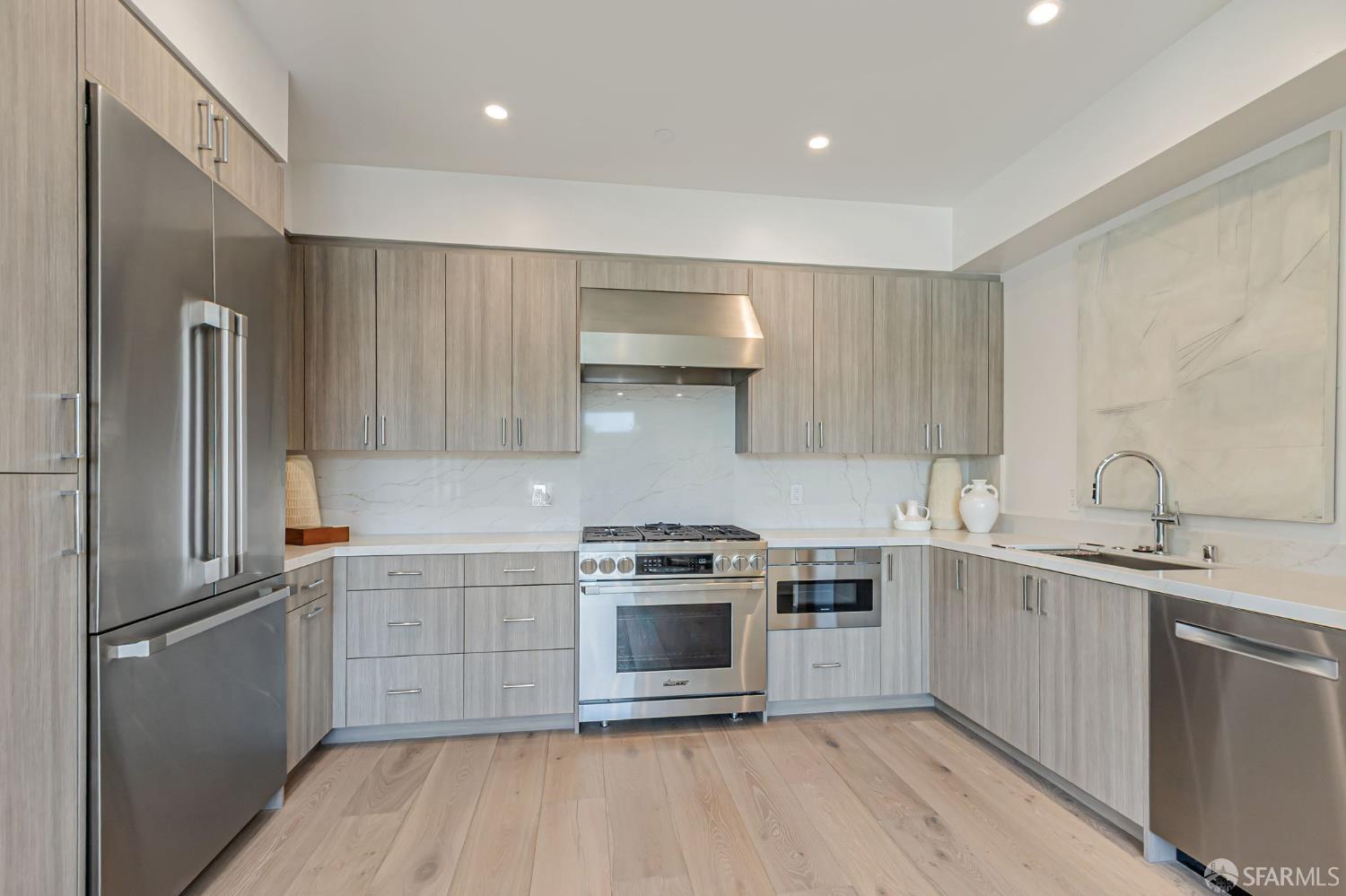 425 1st Street, Unit 21 Los Altos, CA 94022 - Photo 7 of 41 a kitchen with a stove sink and refrigerator
