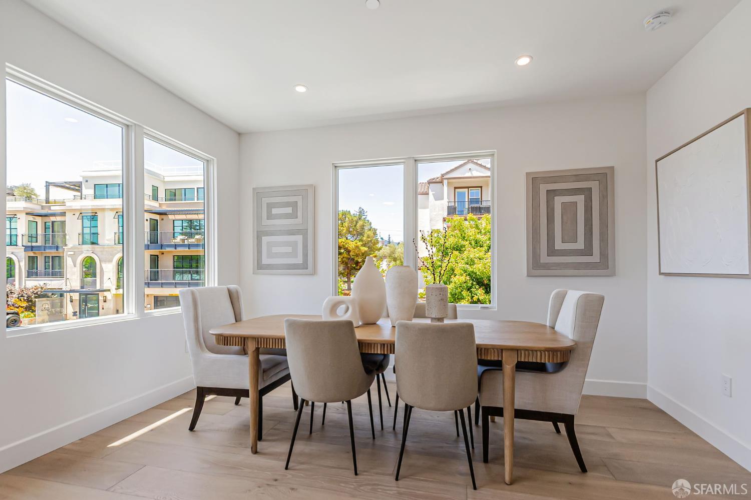 425 1st Street, Unit 21 Los Altos, CA 94022 - Photo 9 of 41 a view of a dining room with furniture and a potted plant