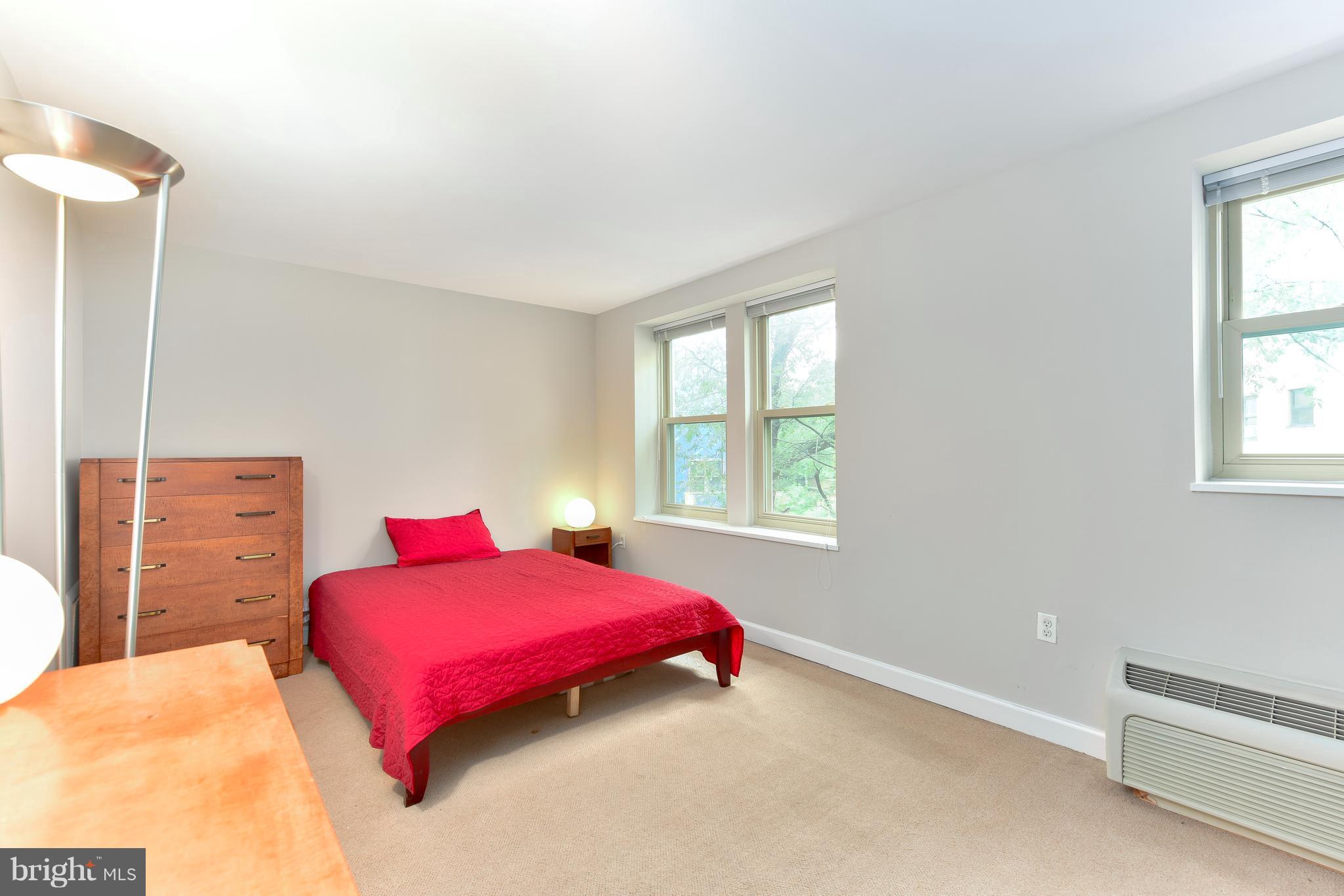 2440 16th Street Northwest, Unit 412 Washington, DC 20009 - Photo 19 of 25 a bedroom with a bed and a window