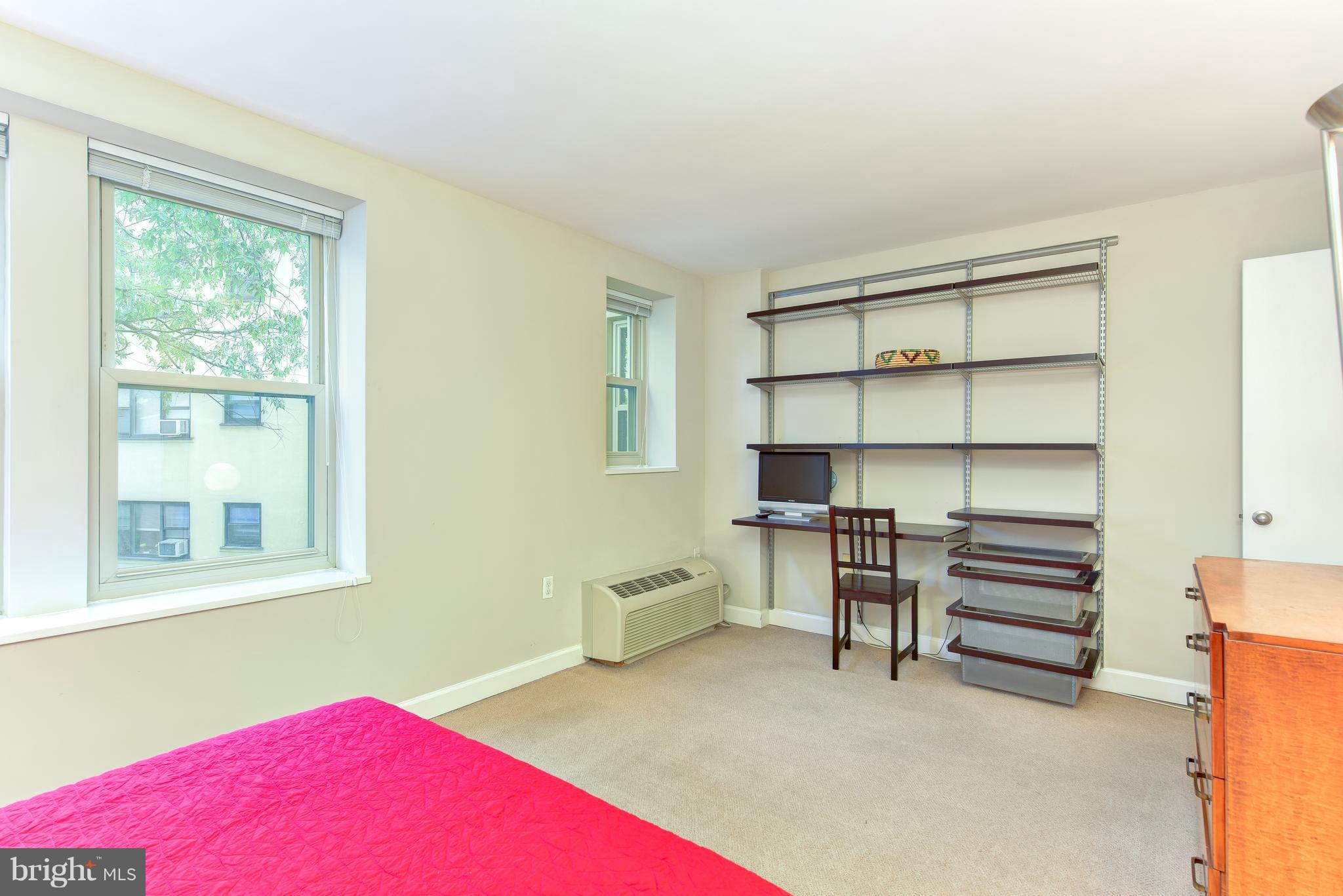 2440 16th Street Northwest, Unit 412 Washington, DC 20009 - Photo 20 of 25 a living room with furniture and a window